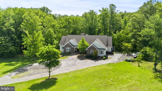 6707 Burch Hill Rd, Brandywine, MD 20613 - view of front facade featuring asphalt driveway, a front lawn, a chimney, and a view of trees