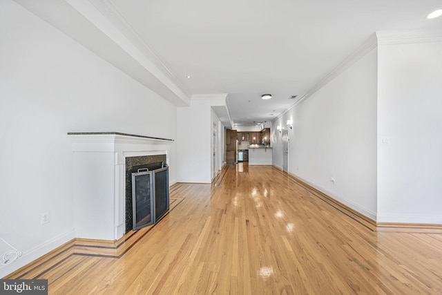 1319 Euclid St NW Unit 3, Washington, DC 20009 - unfurnished living room featuring crown molding, light wood-style flooring, a fireplace, and baseboards