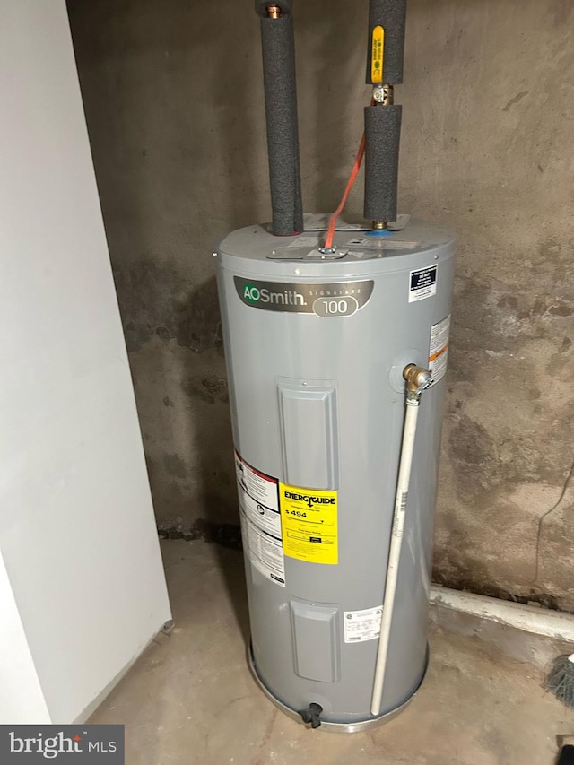 utility room featuring water heater