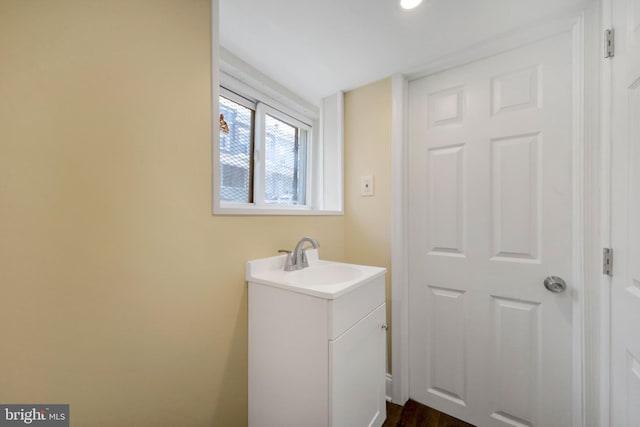 bathroom with recessed lighting and vanity
