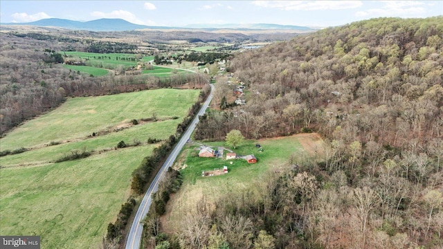 birds eye view of property with a rural view and a mountain view
