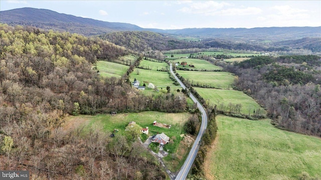 drone / aerial view featuring a rural view and a mountain view