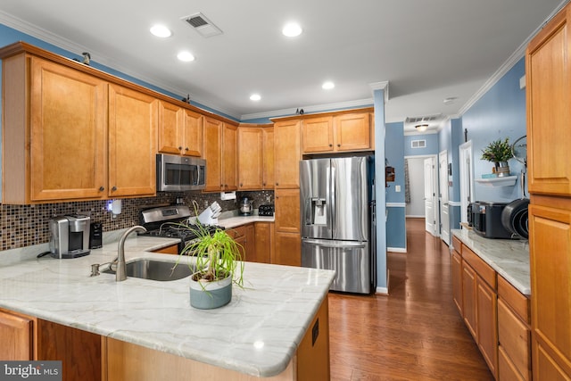 105 Cresthaven Ln, Dover, DE 19901 - kitchen featuring appliances with stainless steel finishes, dark wood-style floors, ornamental molding, a peninsula, and tasteful backsplash