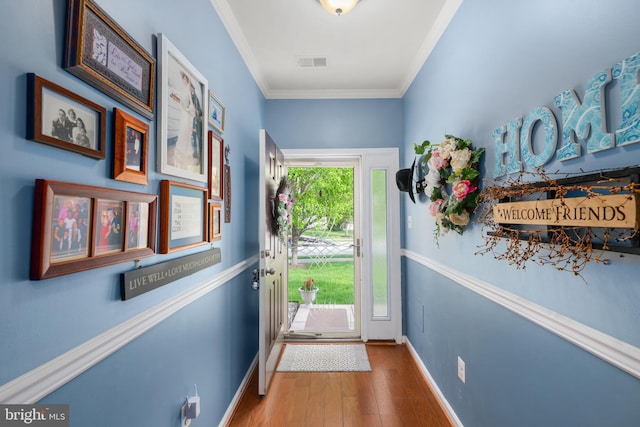 105 Cresthaven Ln, Dover, DE 19901 - doorway to outside with wood finished floors, baseboards, and ornamental molding
