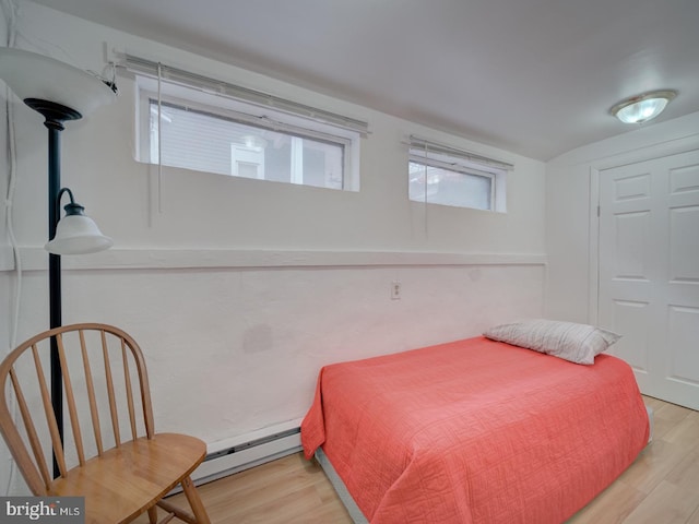 1234 Monroe St NE, Washington, DC 20017 - bedroom with a baseboard radiator and wood finished floors