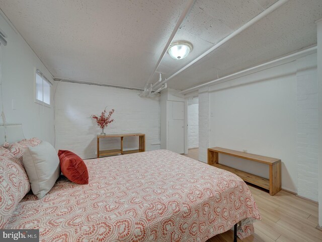 1234 Monroe St NE, Washington, DC 20017 - bedroom featuring wood finished floors and a textured ceiling