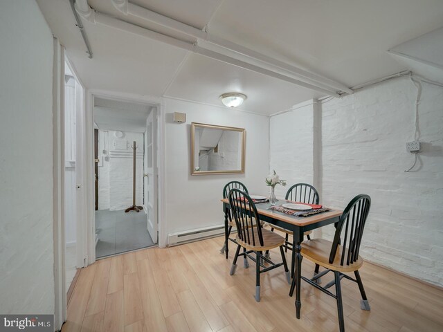 1234 Monroe St NE, Washington, DC 20017 - dining space with a baseboard radiator and light wood-style floors