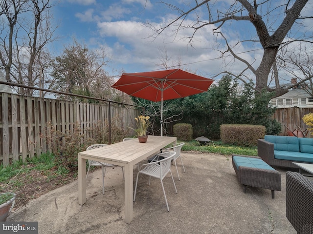 1234 Monroe St NE, Washington, DC 20017 - view of patio with outdoor dining area, a fenced backyard, and an outdoor hangout area
