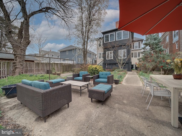 1234 Monroe St NE, Washington, DC 20017 - view of patio / terrace with an outdoor living space, fence, outdoor dining space, and a residential view