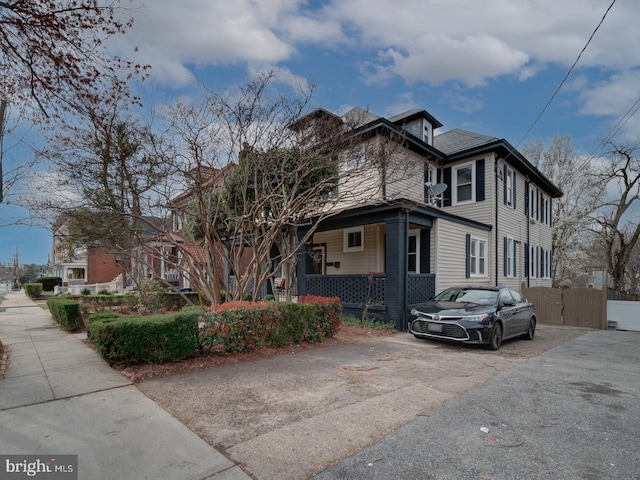 1234 Monroe St NE, Washington, DC 20017 - view of side of home featuring fence and covered porch