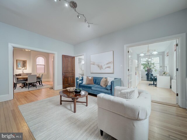 1234 Monroe St NE, Washington, DC 20017 - living area featuring light wood-style floors and baseboards