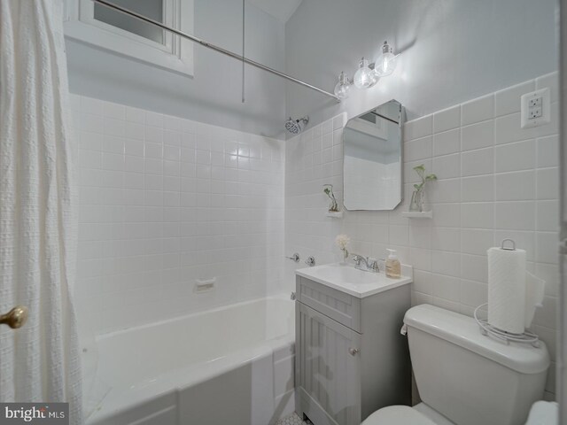 1234 Monroe St NE, Washington, DC 20017 - full bathroom featuring shower / tub combo with curtain, vanity, tile walls, and toilet