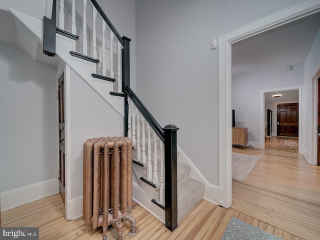 1234 Monroe St NE, Washington, DC 20017 - stairway featuring hardwood / wood-style floors, radiator, and baseboards