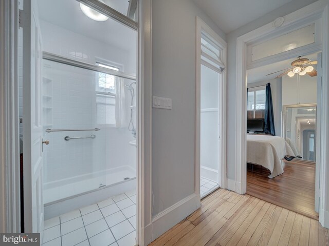 1234 Monroe St NE, Washington, DC 20017 - hallway with plenty of natural light, baseboards, and wood finished floors