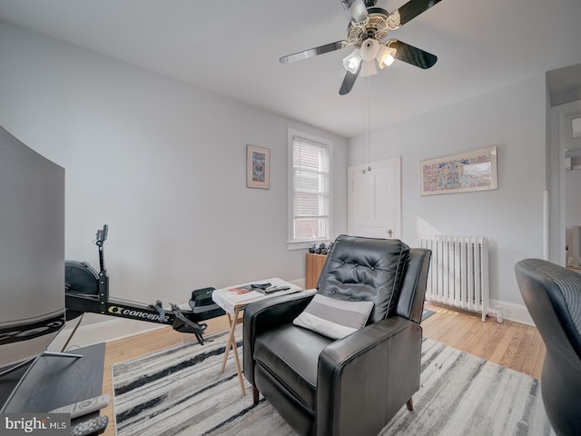 1234 Monroe St NE, Washington, DC 20017 - interior space featuring ceiling fan, radiator, wood finished floors, and baseboards