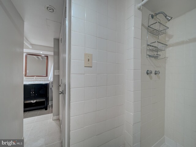 1234 Monroe St NE, Washington, DC 20017 - bathroom featuring tiled shower, vanity, and tile patterned flooring