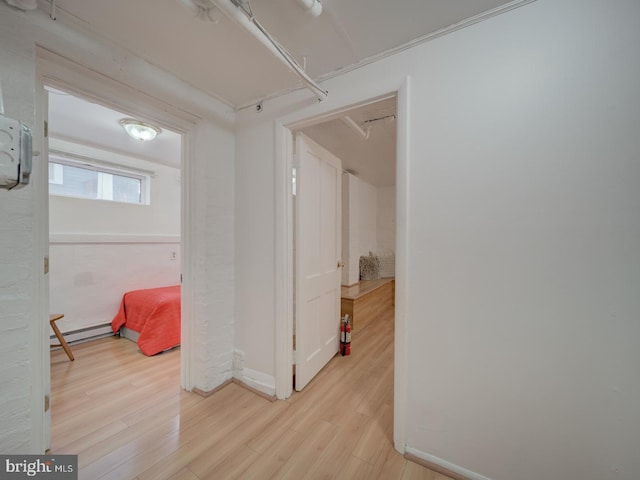 1234 Monroe St NE, Washington, DC 20017 - hallway featuring baseboard heating, baseboards, and wood finished floors