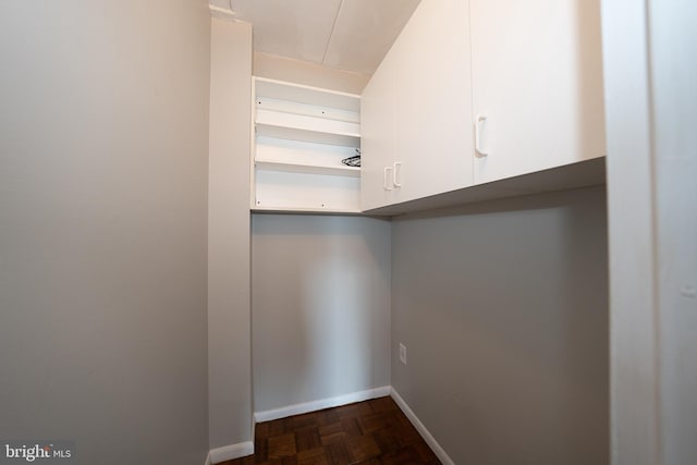 spacious closet featuring attic access