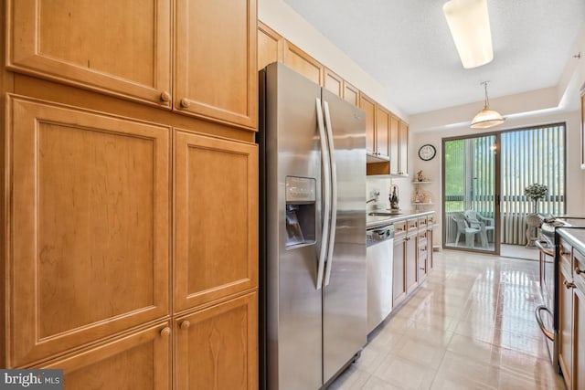 2901 S Leisure World Blvd Unit 133, Silver Spring, MD 20906 - kitchen with appliances with stainless steel finishes, light tile patterned flooring, decorative light fixtures, a sink, and light countertops
