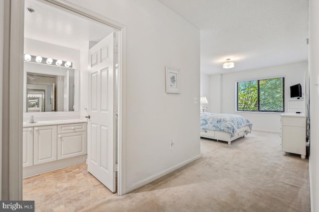 2901 S Leisure World Blvd Unit 133, Silver Spring, MD 20906 - bedroom with light carpet, baseboards, and connected bathroom