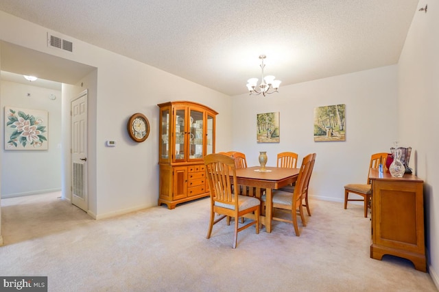 2901 S Leisure World Blvd Unit 133, Silver Spring, MD 20906 - dining area featuring a chandelier, light carpet, baseboards, and a textured ceiling