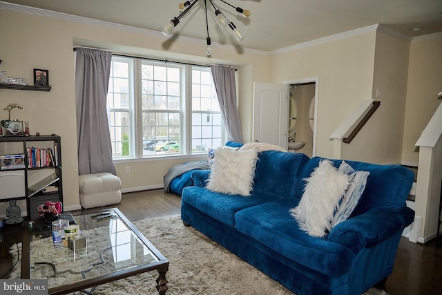 living area with wood finished floors, baseboards, ornamental molding, and a healthy amount of sunlight