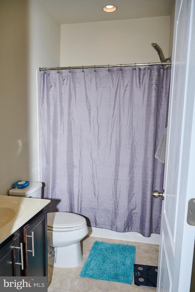 full bathroom with tile patterned flooring, toilet, a shower with shower curtain, and vanity