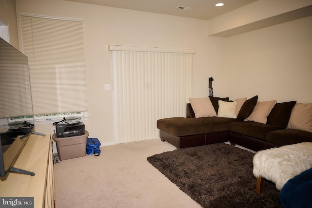carpeted living room with recessed lighting and visible vents