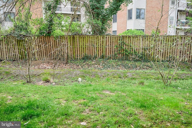view of yard with a fenced backyard