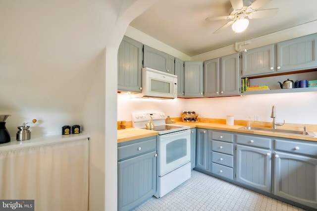 27 Ridge Rd, Greenbelt, MD 20770 - kitchen featuring a sink, light countertops, ceiling fan, and white appliances