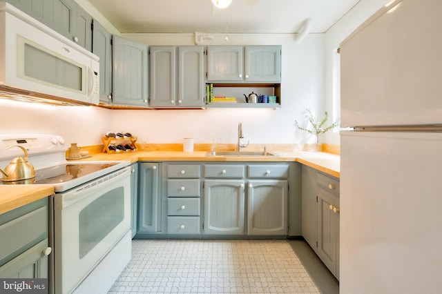 27 Ridge Rd, Greenbelt, MD 20770 - kitchen featuring a sink and white appliances