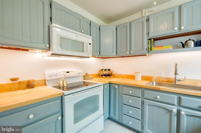 27 Ridge Rd, Greenbelt, MD 20770 - kitchen with a sink, open shelves, and white appliances
