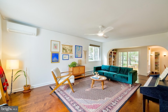 27 Ridge Rd, Greenbelt, MD 20770 - living area with baseboards, arched walkways, a wall mounted air conditioner, a ceiling fan, and wood finished floors