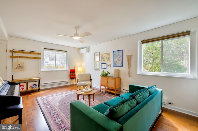 27 Ridge Rd, Greenbelt, MD 20770 - living area with a ceiling fan, wood finished floors, a baseboard heating unit, a wall mounted air conditioner, and baseboards