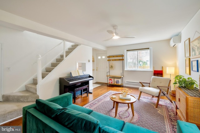 27 Ridge Rd, Greenbelt, MD 20770 - living area featuring stairway, a wall unit AC, a ceiling fan, and wood finished floors