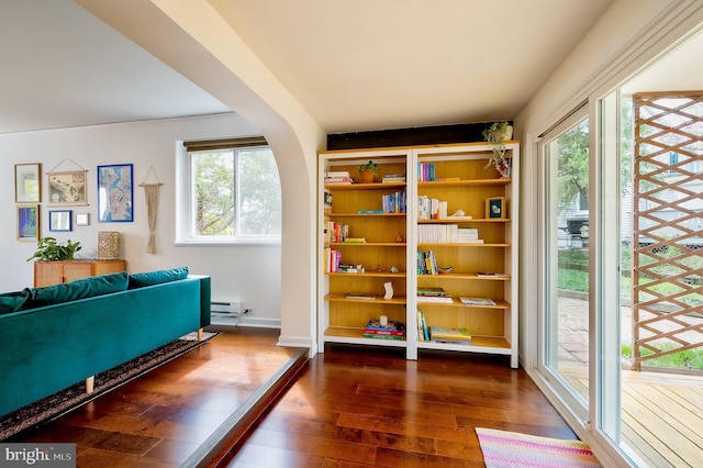 27 Ridge Rd, Greenbelt, MD 20770 - living area featuring dark wood-type flooring, a baseboard radiator, and plenty of natural light