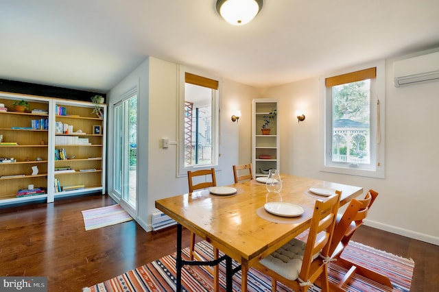 27 Ridge Rd, Greenbelt, MD 20770 - dining room featuring a wall mounted air conditioner, baseboards, and dark wood finished floors