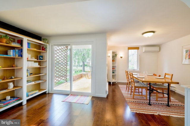 27 Ridge Rd, Greenbelt, MD 20770 - dining room featuring dark wood-type flooring, a wall mounted air conditioner, and baseboards