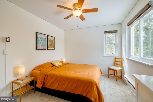 27 Ridge Rd, Greenbelt, MD 20770 - bedroom featuring baseboard heating, ceiling fan, light colored carpet, and baseboards