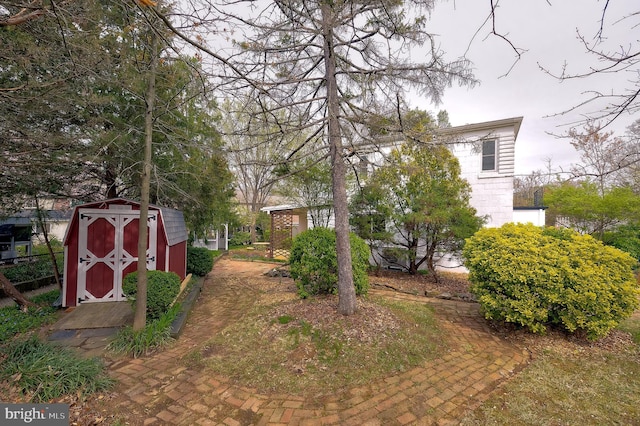 27 Ridge Rd, Greenbelt, MD 20770 - view of yard with a storage shed and an outbuilding