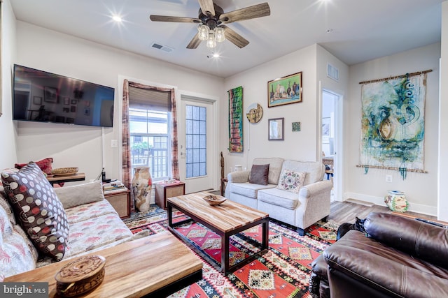 104 Saint Ives Pl Unit 409, Oxon Hill, MD 20745 - living room with visible vents, baseboards, a ceiling fan, and wood finished floors