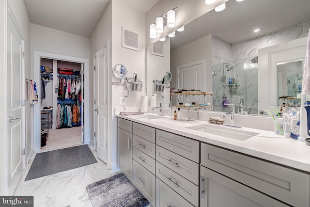 104 Saint Ives Pl Unit 409, Oxon Hill, MD 20745 - bathroom with double vanity, marble finish floor, a sink, and a marble finish shower