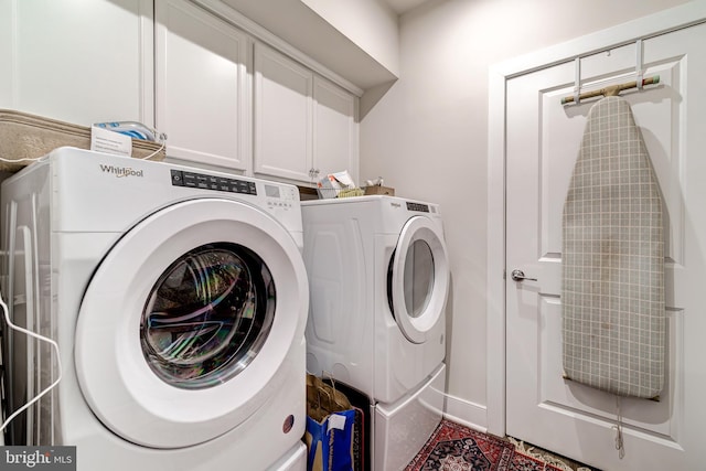 104 Saint Ives Pl Unit 409, Oxon Hill, MD 20745 - laundry area featuring washing machine and clothes dryer and cabinet space