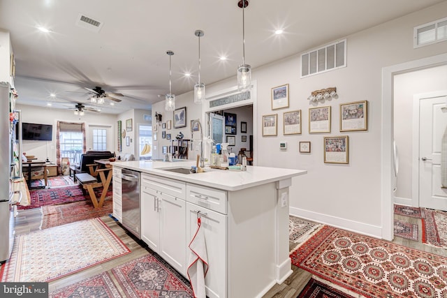 104 Saint Ives Pl Unit 409, Oxon Hill, MD 20745 - kitchen featuring white cabinets, visible vents, open floor plan, and dishwasher