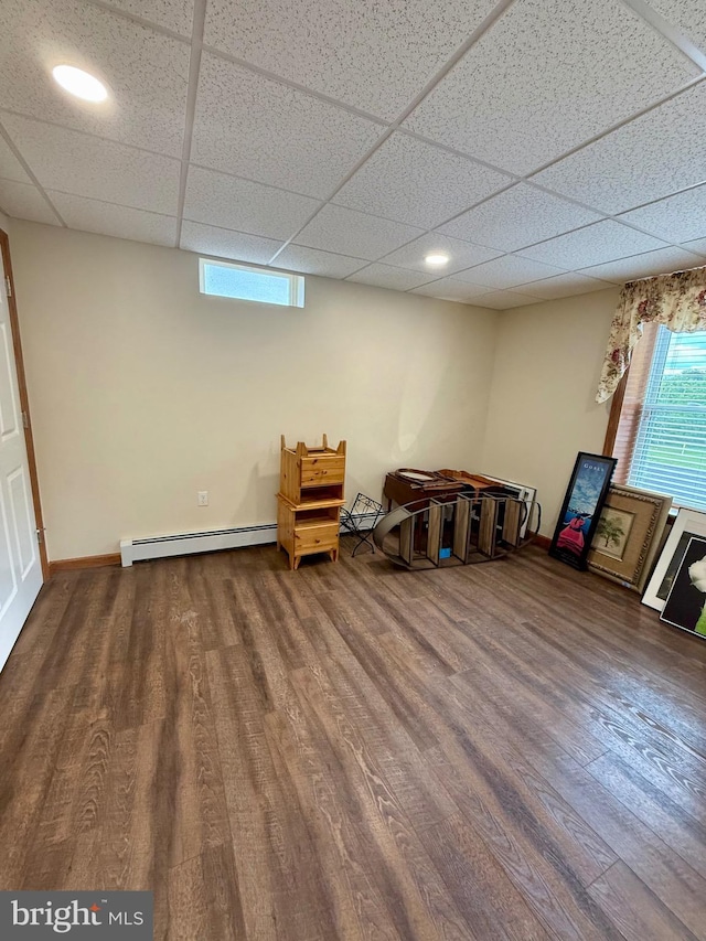 11003 Marty St NW, Lavale, MD 21502 - rec room with a baseboard heating unit, wood finished floors, a drop ceiling, and baseboards