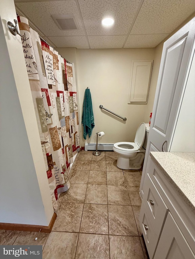 11003 Marty St NW, Lavale, MD 21502 - full bath with a baseboard radiator, vanity, toilet, baseboards, and tile patterned flooring