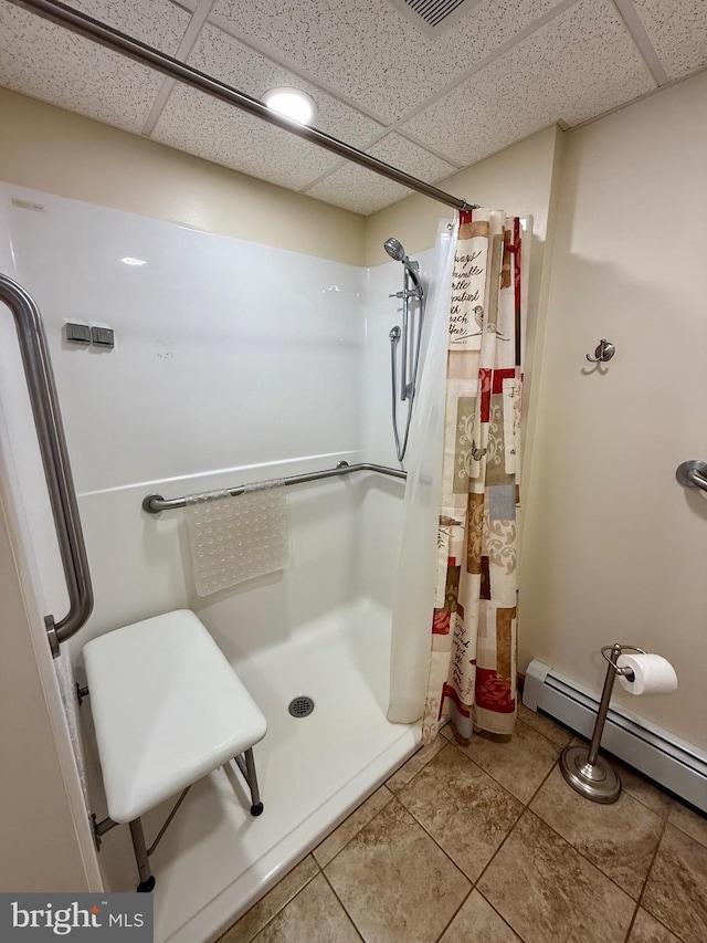 11003 Marty St NW, Lavale, MD 21502 - full bath with a shower stall, tile patterned flooring, a baseboard radiator, and a drop ceiling