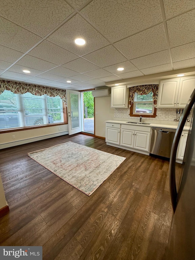 11003 Marty St NW, Lavale, MD 21502 - kitchen with dishwasher, white cabinets, light countertops, a sink, and backsplash