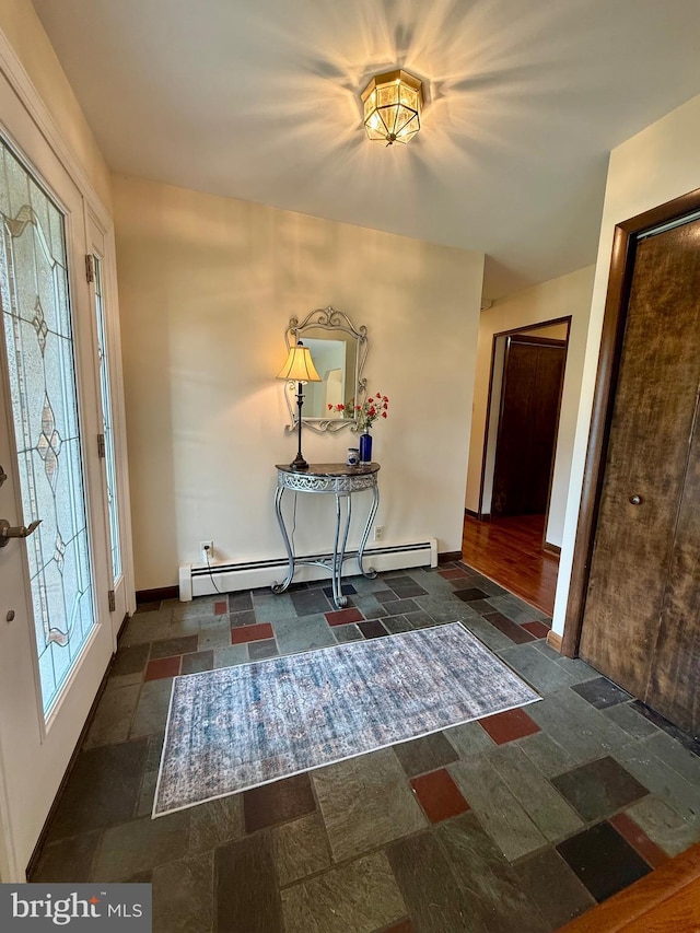 11003 Marty St NW, Lavale, MD 21502 - entryway featuring baseboard heating, stone tile flooring, and baseboards