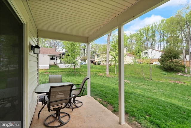 view of patio / terrace with a residential view and outdoor dining space